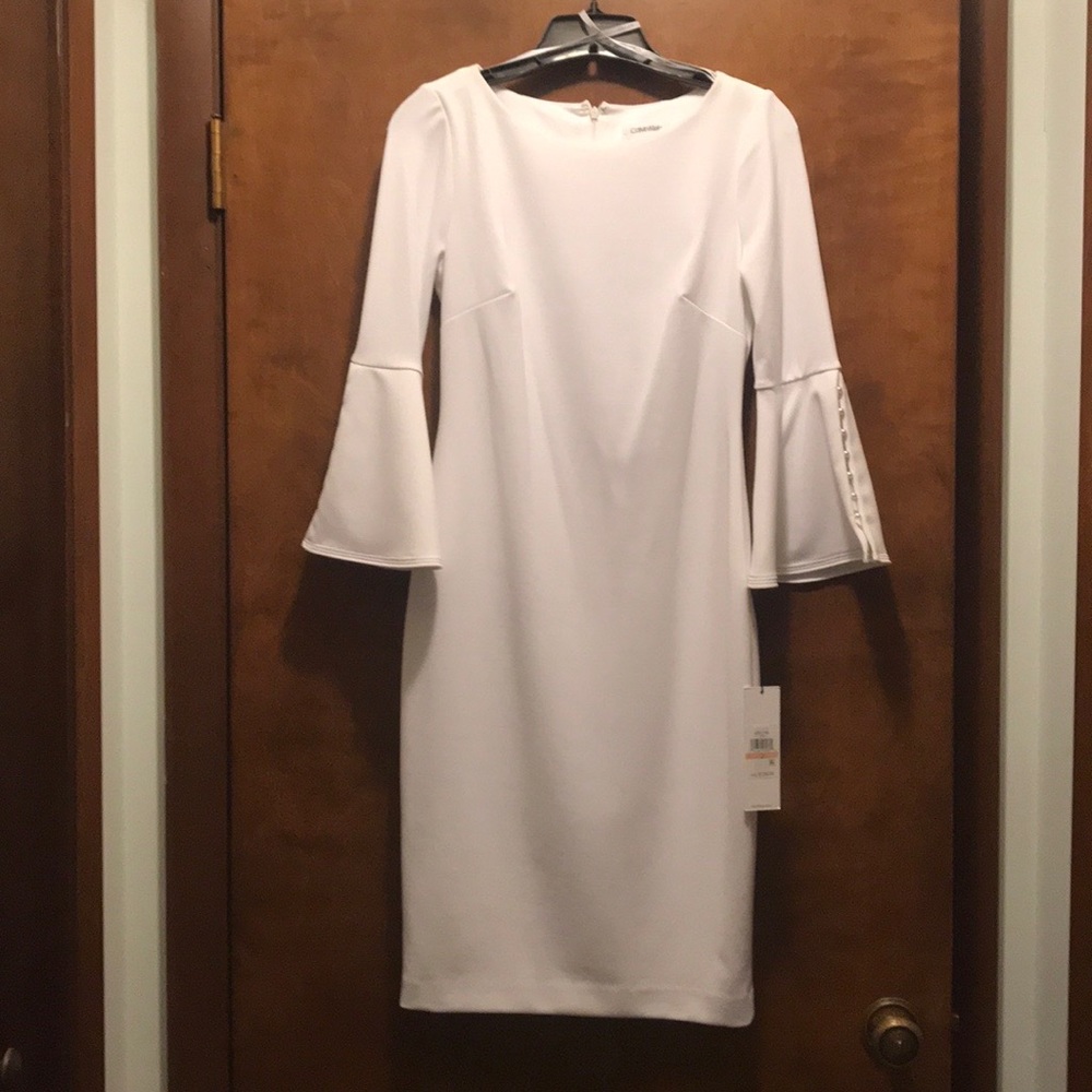 White Calvin Klein knee-length dress.
